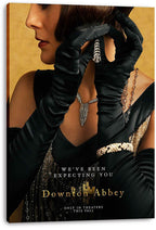 Downton Abbey canvas wall art print displays a gloved woman in a black gown with silver jewelry on a warm gold background.