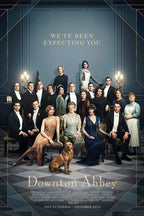 Downton Abbey movie poster wall art with an ensemble in formal period dress, a seated dog, blue paneled room, and gold lettering.