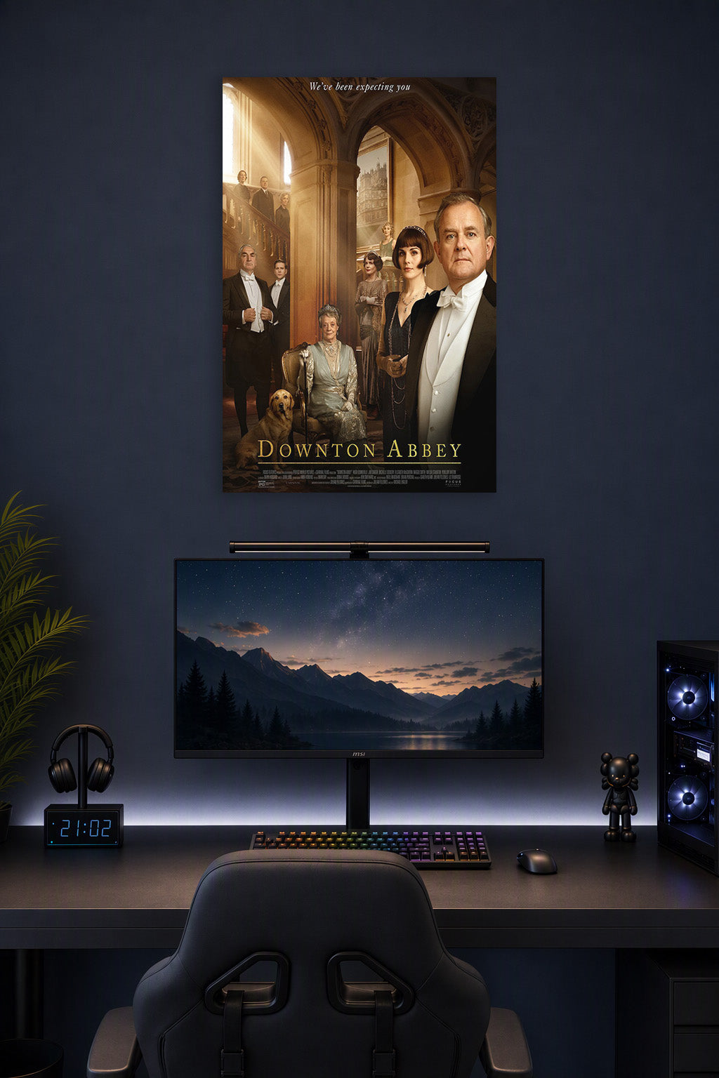 Downton Abbey Movie Poster in a gaming desk setup above a monitor.