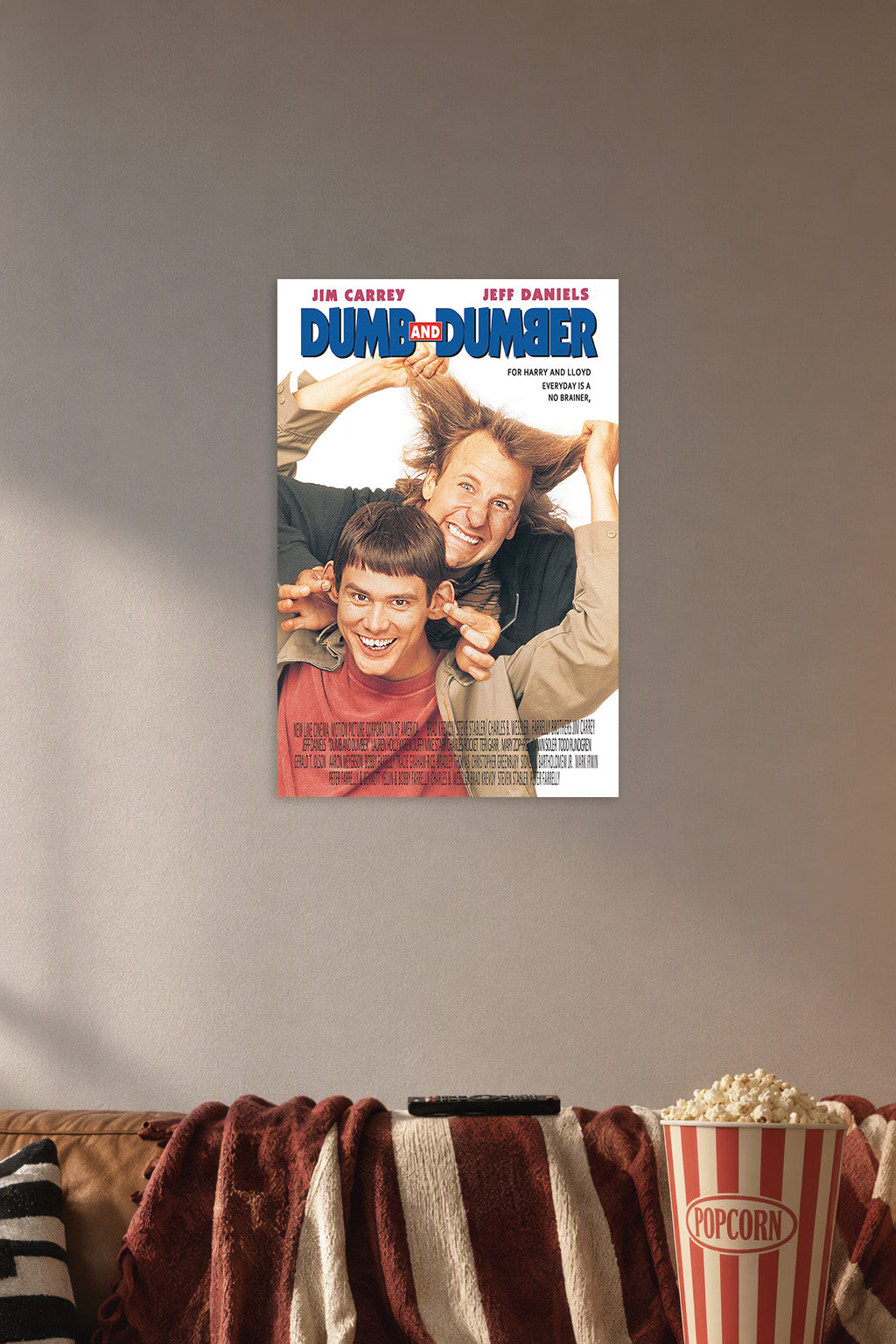 Dumb and Dumber Movie Poster Jim Carrey Jeff Daniels in a cozy movie room above a brown sofa with popcorn.