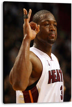 Dwyane Wade canvas wall art print displays the Miami Heat guard in a white number 3 jersey against a blurred arena background.