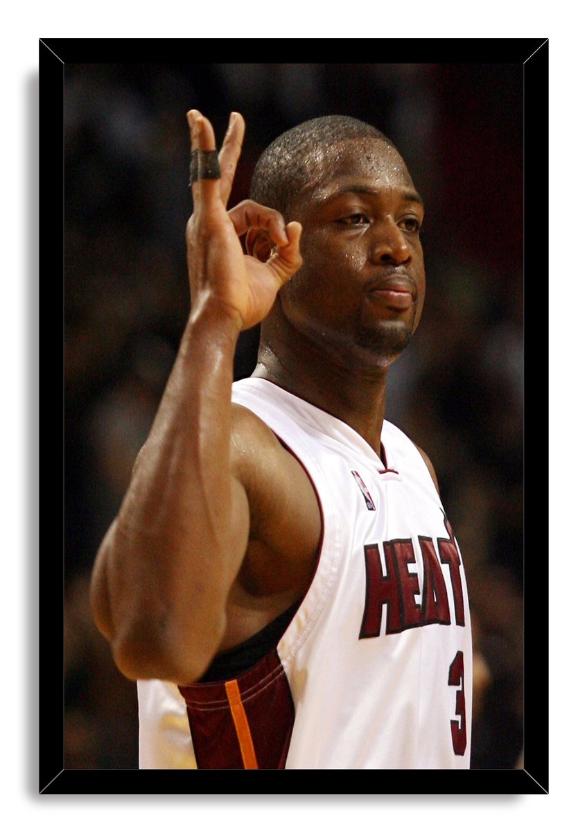 Dwyane Wade framed wall art print presents the Miami Heat player making an OK gesture in his white number 3 uniform.
