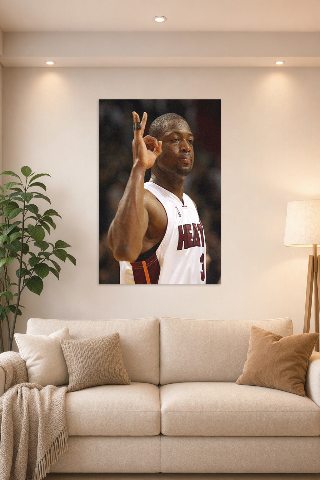 Dwyane Wade in a bright living room above a beige sofa.