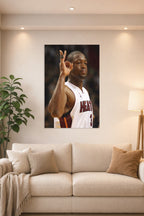 Dwyane Wade in a bright living room above a beige sofa.