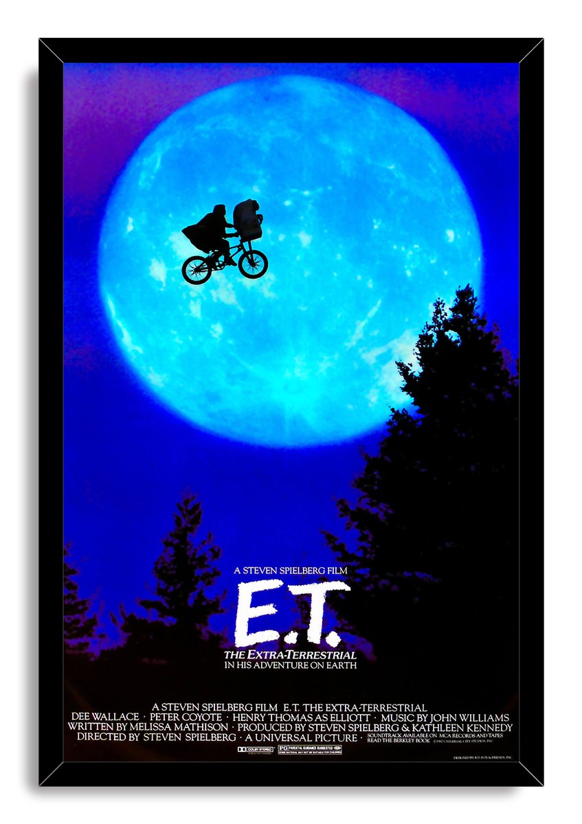E.T. The Extra-Terrestrial framed wall art print with a black border, luminous blue moon, flying bicycle silhouette, and dark treetops.