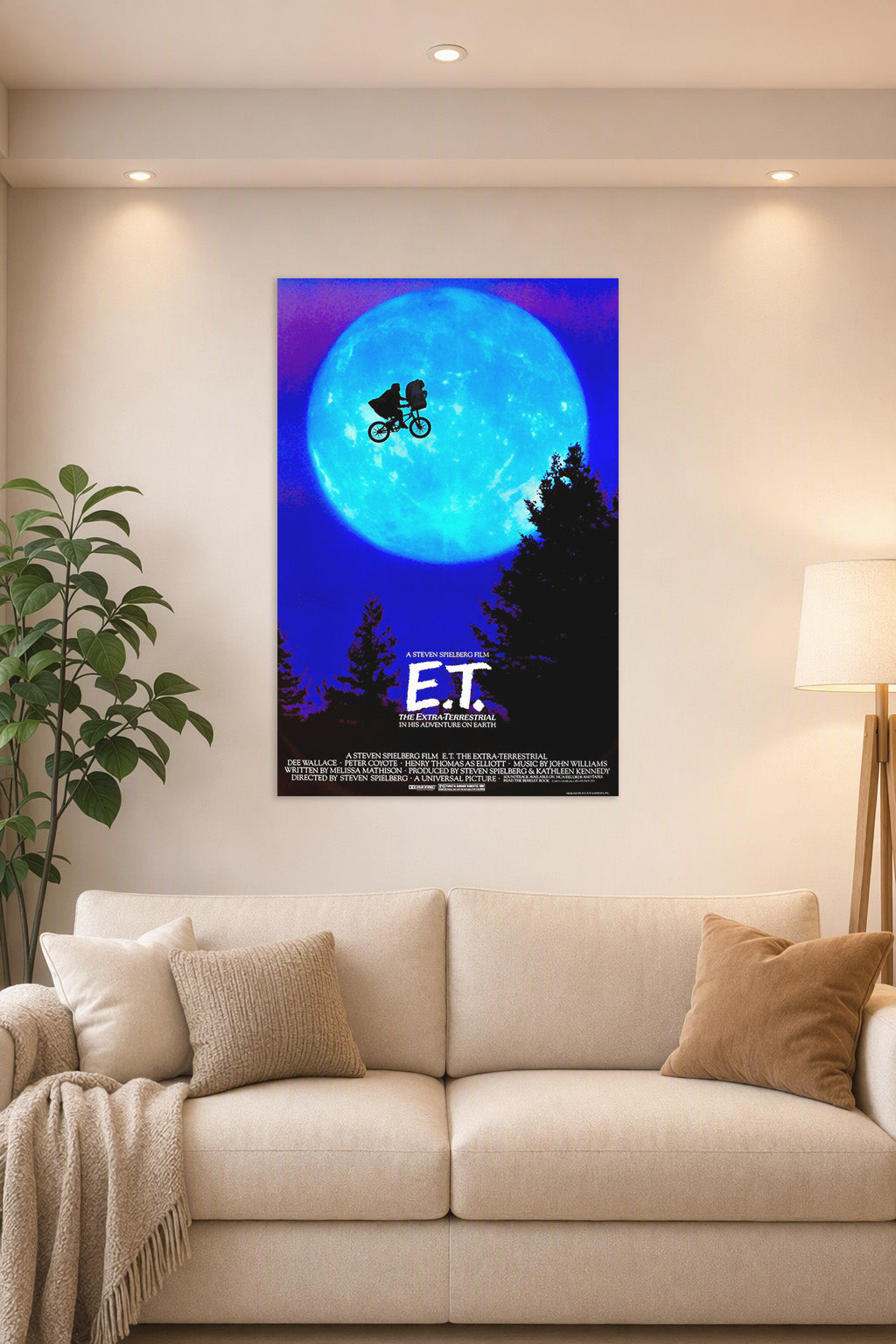 E.T. The Extra-Terrestrial in a bright living room above a beige sofa.