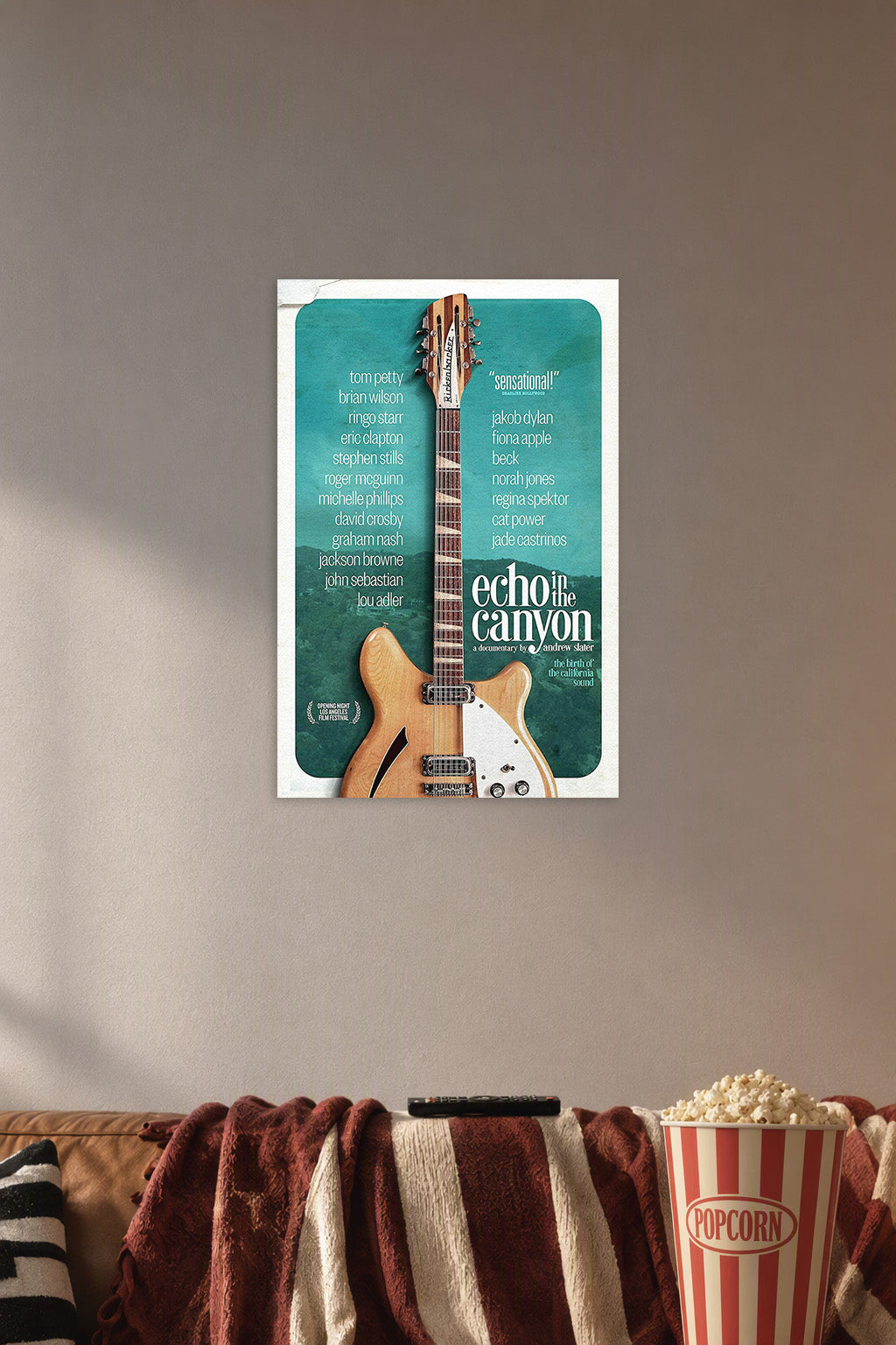 Echo in the Canyon Documentary Movie Poster in a cozy movie room above a brown sofa with popcorn.
