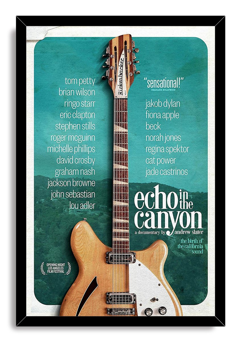 Echo in the Canyon framed wall art print with a black border, wood electric guitar, teal canyon backdrop, and white typography.