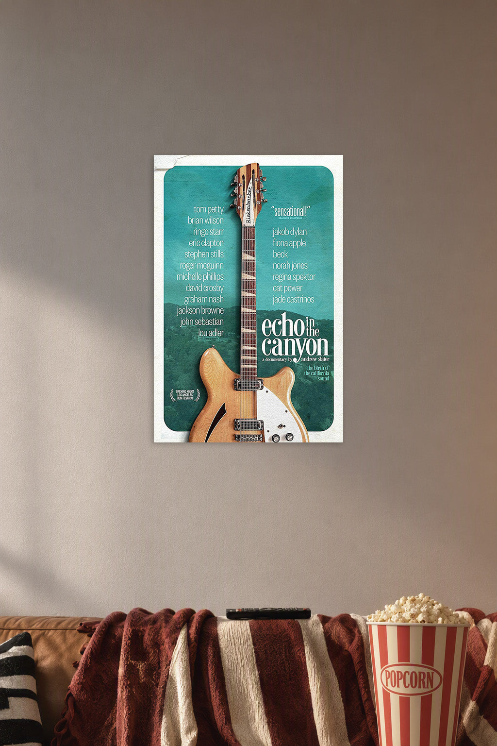 Echo in the Canyon Movie Poster with Musicians in a cozy movie room above a brown sofa with popcorn.