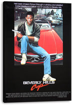 Beverly Hills Cop canvas wall art presents Eddie Murphy holding a pistol on a red Mercedes amid busy city traffic.