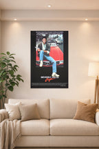 Eddie Murphy Beverly Hills Cop in a bright living room above a beige sofa.