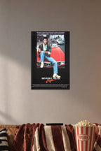 Eddie Murphy Beverly Hills Cop in a cozy movie room above a brown sofa with popcorn.