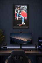 Eddie Murphy Beverly Hills Cop in a gaming desk setup above a monitor.