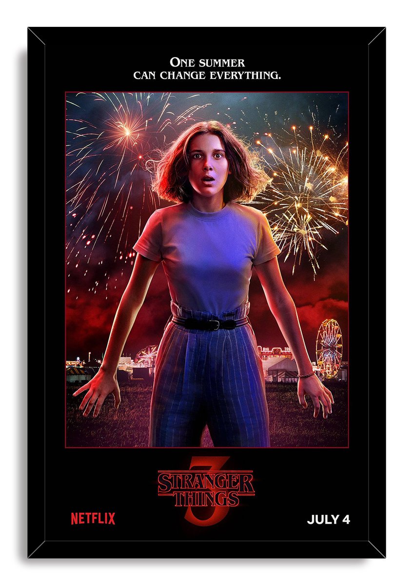 Eleven Stranger Things framed wall art print portrays Eleven under vivid fireworks, bordered in black with Netflix and July 4 text.