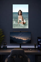 Elizabeth Taylor in a gaming desk setup above a monitor.