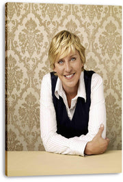 Ellen DeGeneres canvas wall art print featuring her smiling in a striped white shirt and dark vest against ornate beige wallpaper.