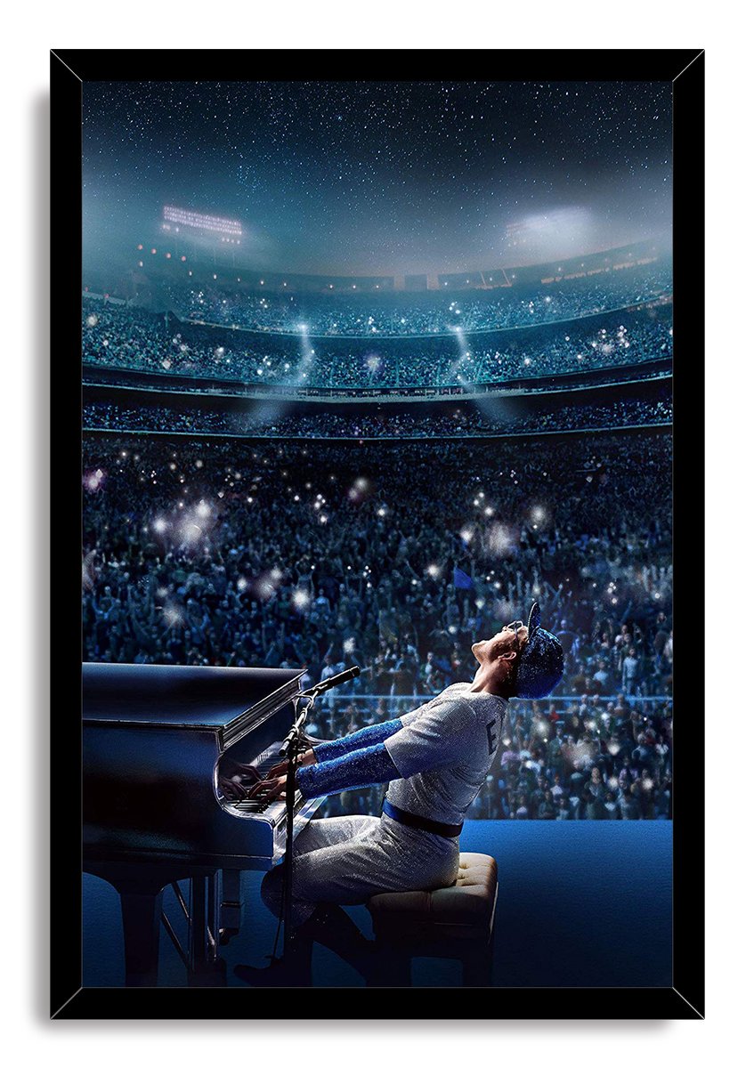 Elton John Rocketman framed wall art print portrays a sparkling-suited pianist performing before a packed blue stadium under a starry sky.
