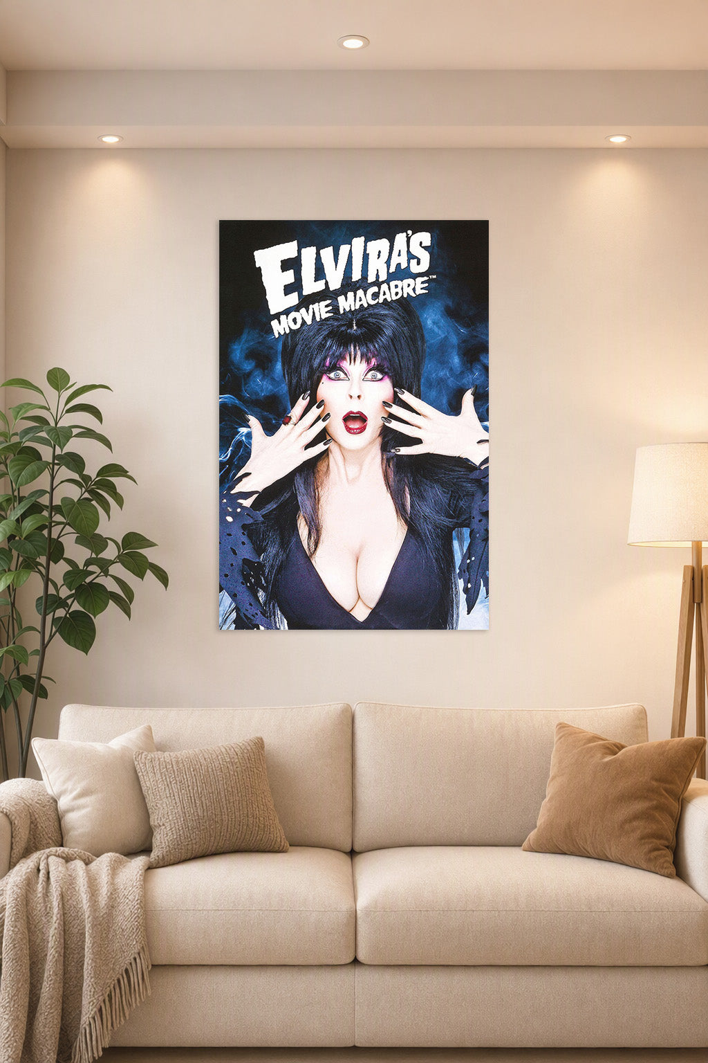 Elvira Mistress of the Dark in a bright living room above a beige sofa.