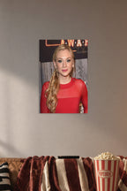 Emily Kinney in a cozy movie room above a brown sofa with popcorn.