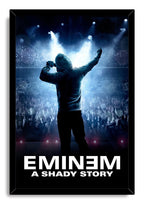 Eminem framed wall art print portrays a hooded performer holding a microphone above a cheering concert crowd, illuminated by blue stage lights.