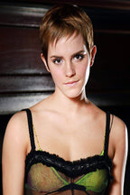 Emma Watson wall art print portrays the actor with a short brown pixie cut and calm gaze against a dark interior backdrop.