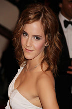 Emma Watson wall art print featuring a close portrait in a white dress, with wavy brown hair and a soft smile at an event.