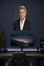 Eric Braeden in a gaming desk setup above a monitor.