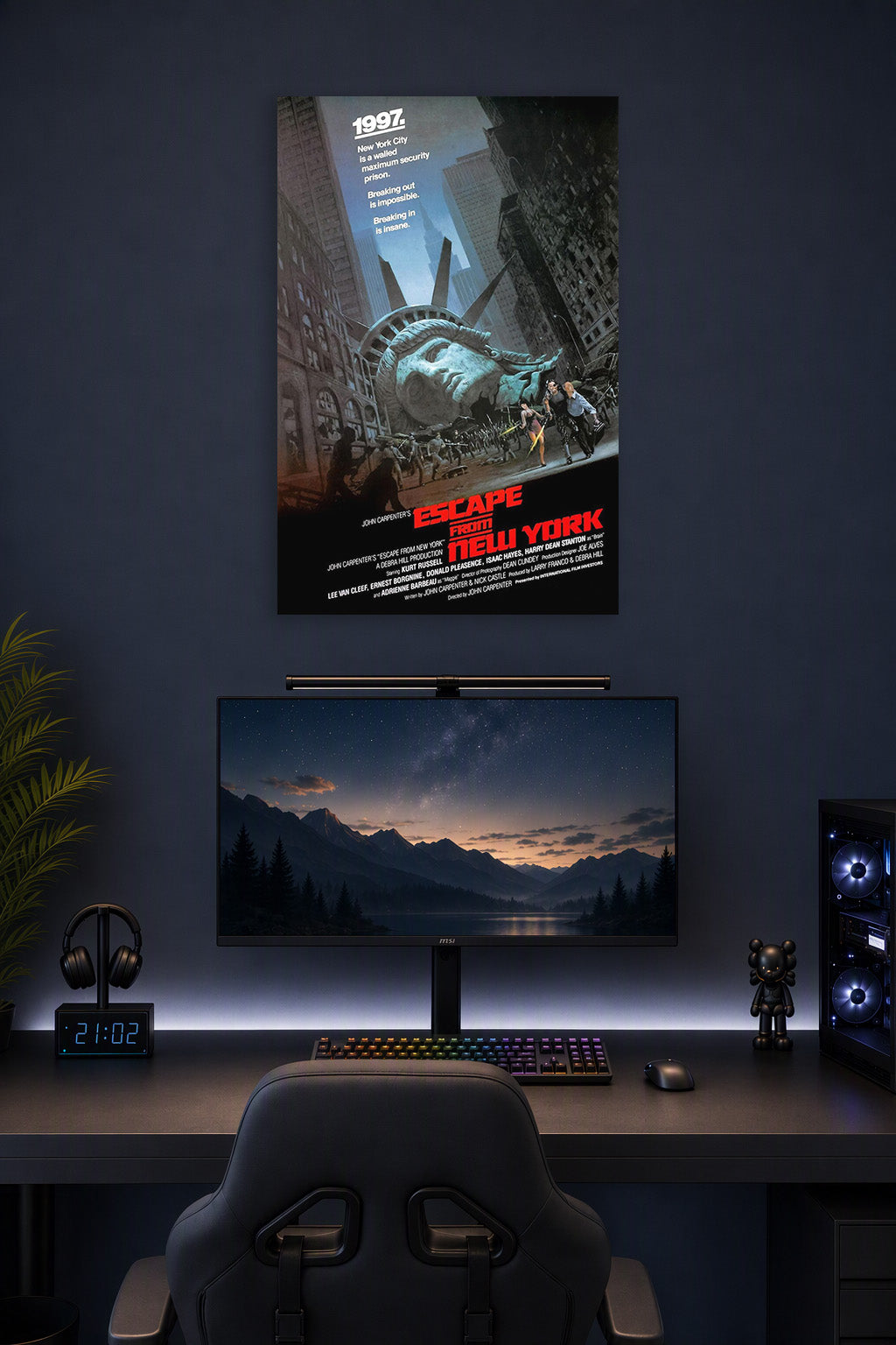 Escape From New York Movie Poster in a gaming desk setup above a monitor.