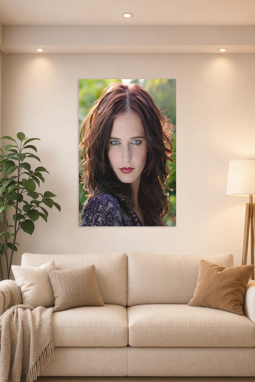 Eva Green in a bright living room above a beige sofa.