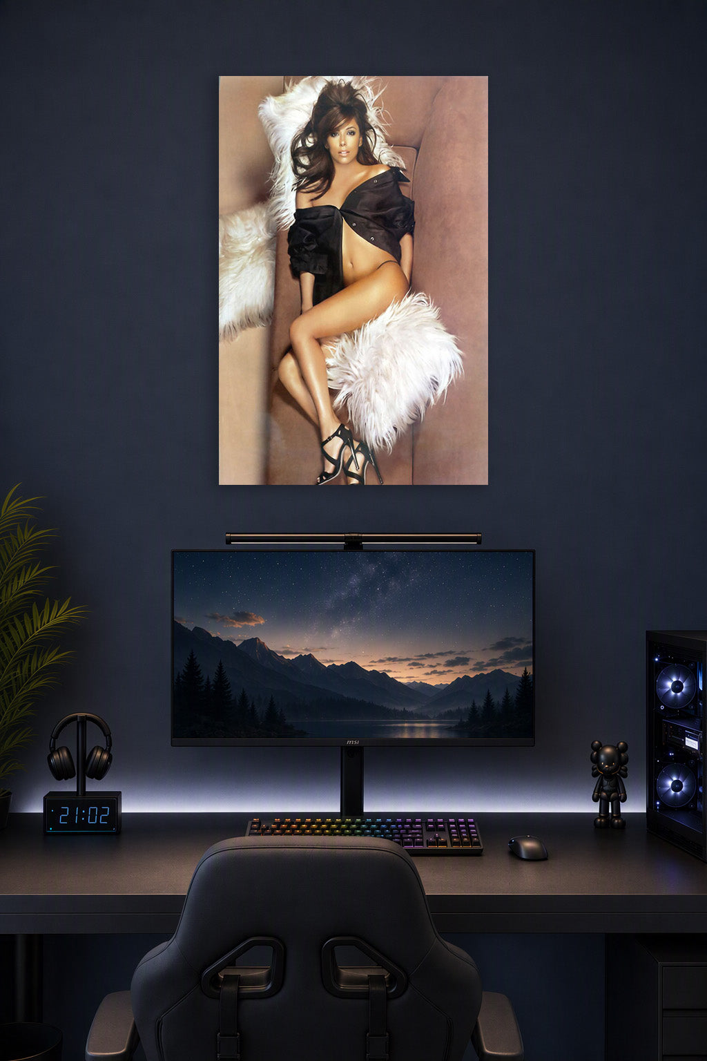 Eva Longoria in a gaming desk setup above a monitor.