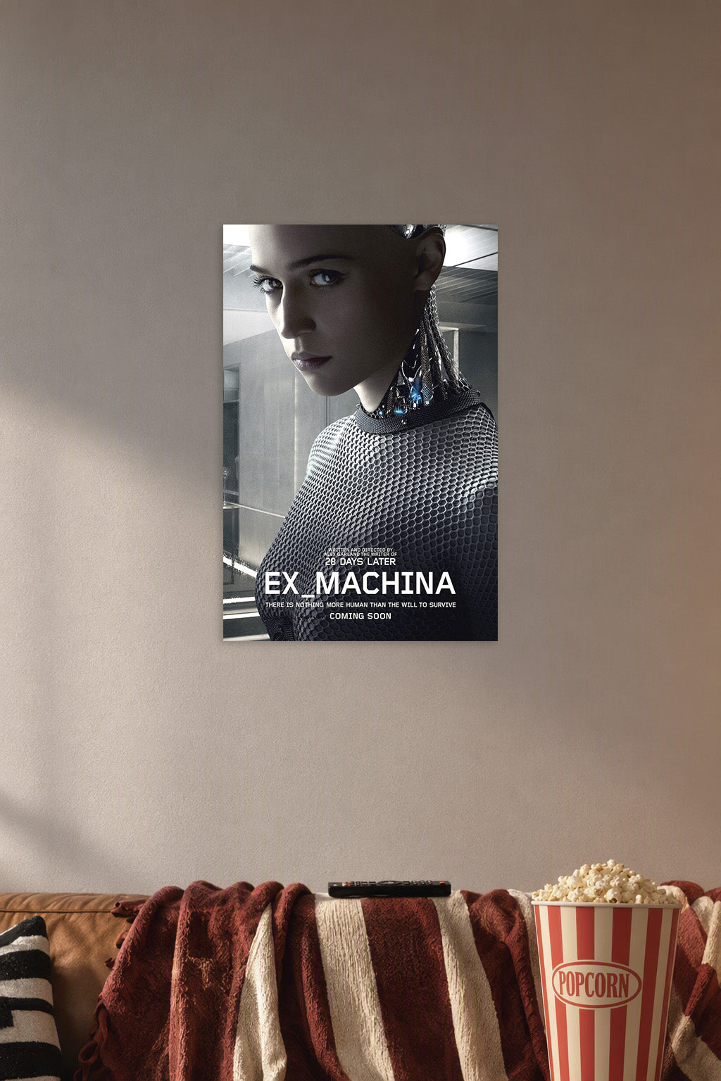 Ex Machina Movie Ava Robot in a cozy movie room above a brown sofa with popcorn.