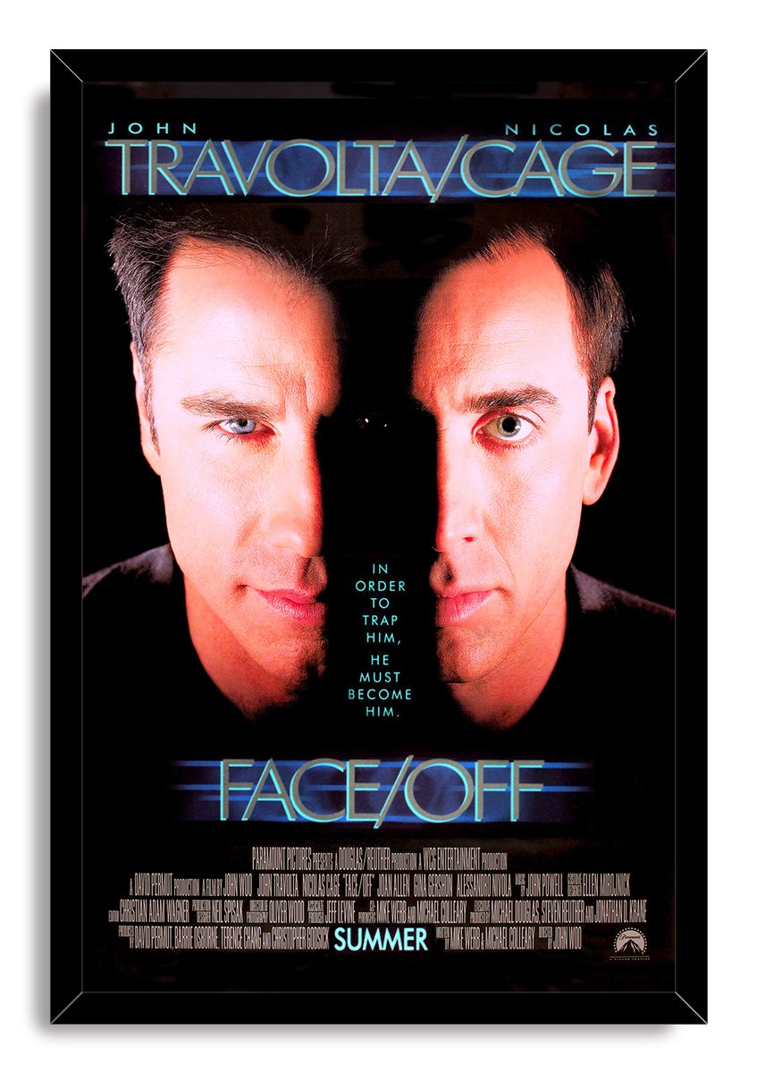 Face/Off framed wall art print with dual close-up portraits of John Travolta and Nicolas Cage, blue lettering, and a black frame.