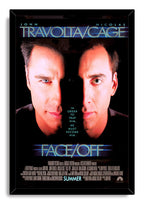 Face/Off framed wall art print with dual close-up portraits of John Travolta and Nicolas Cage, blue lettering, and a black frame.