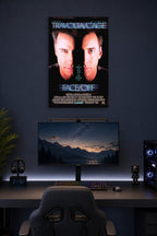Face/Off John Travolta Nicolas Cage in a gaming desk setup above a monitor.