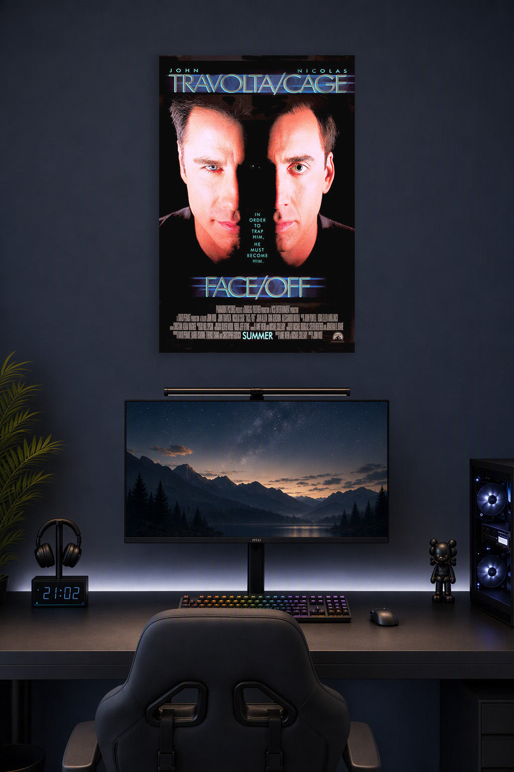 Face/Off John Travolta Nicolas Cage in a gaming desk setup above a monitor.