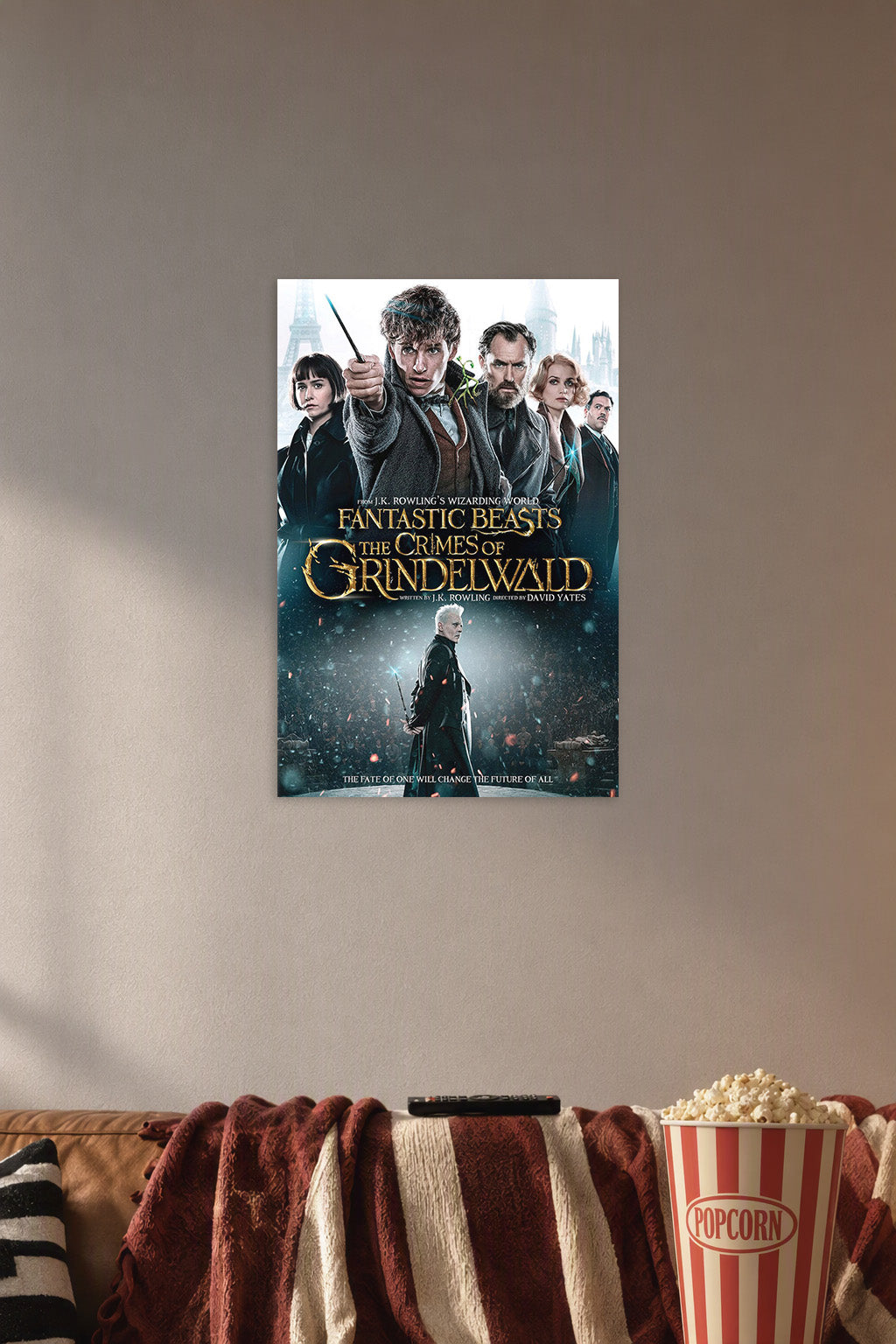 Fantastic Beasts: The Crimes of Grindelwald Movie Poster in a cozy movie room above a brown sofa with popcorn.