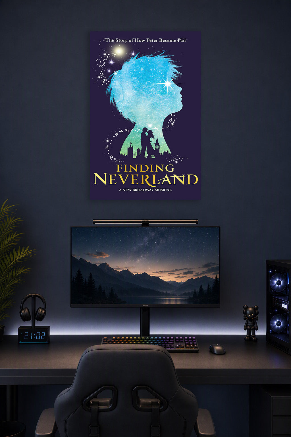 Finding Neverland Musical Poster in a gaming desk setup above a monitor.