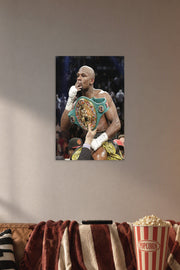 Floyd Mayweather in a cozy movie room above a brown sofa with popcorn.