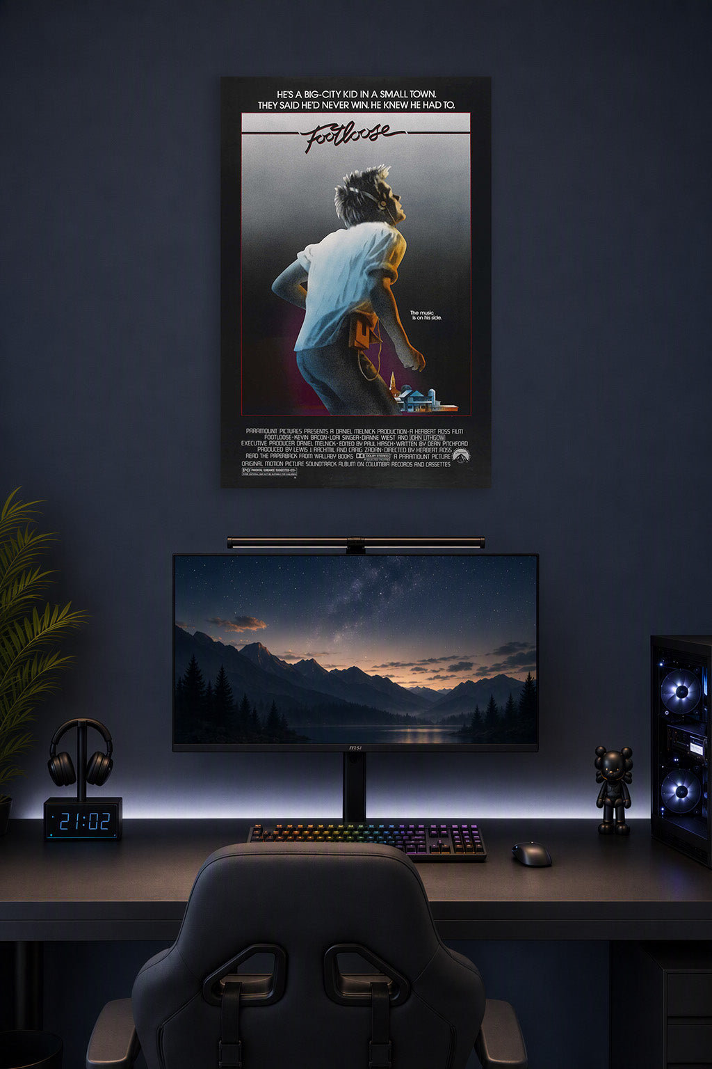 Footloose Movie in a gaming desk setup above a monitor.