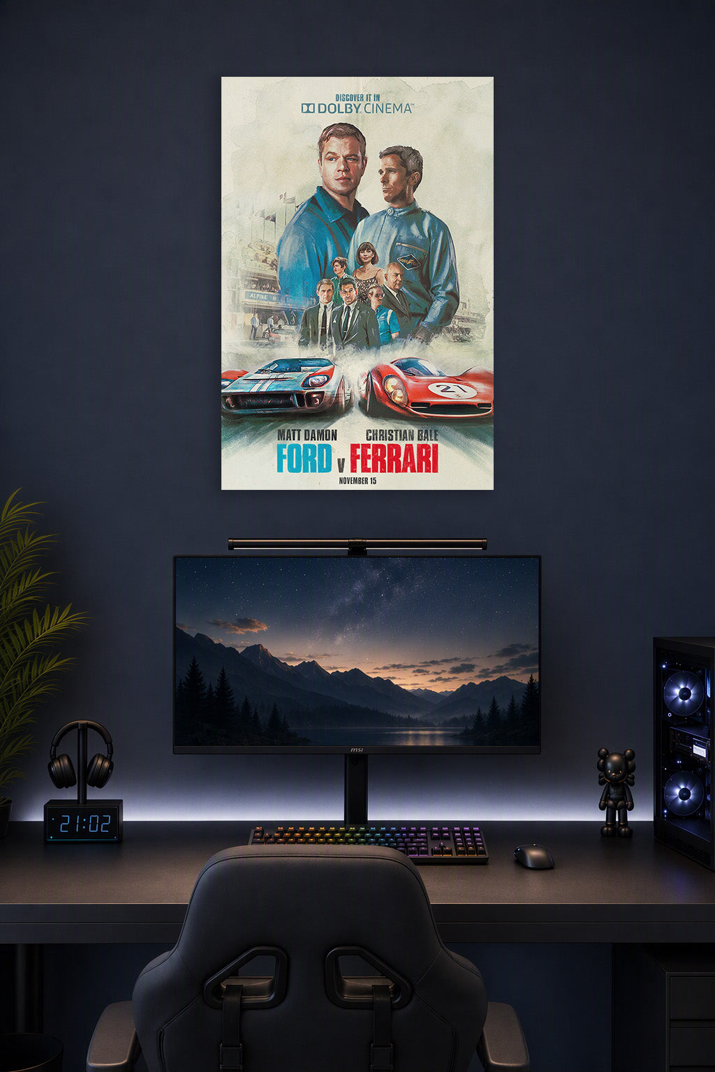 Ford v Ferrari Movie Poster in a gaming desk setup above a monitor.
