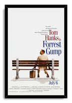 Forrest Gump framed wall art print with Tom Hanks seated behind a park bench, suitcase below, and black border.
