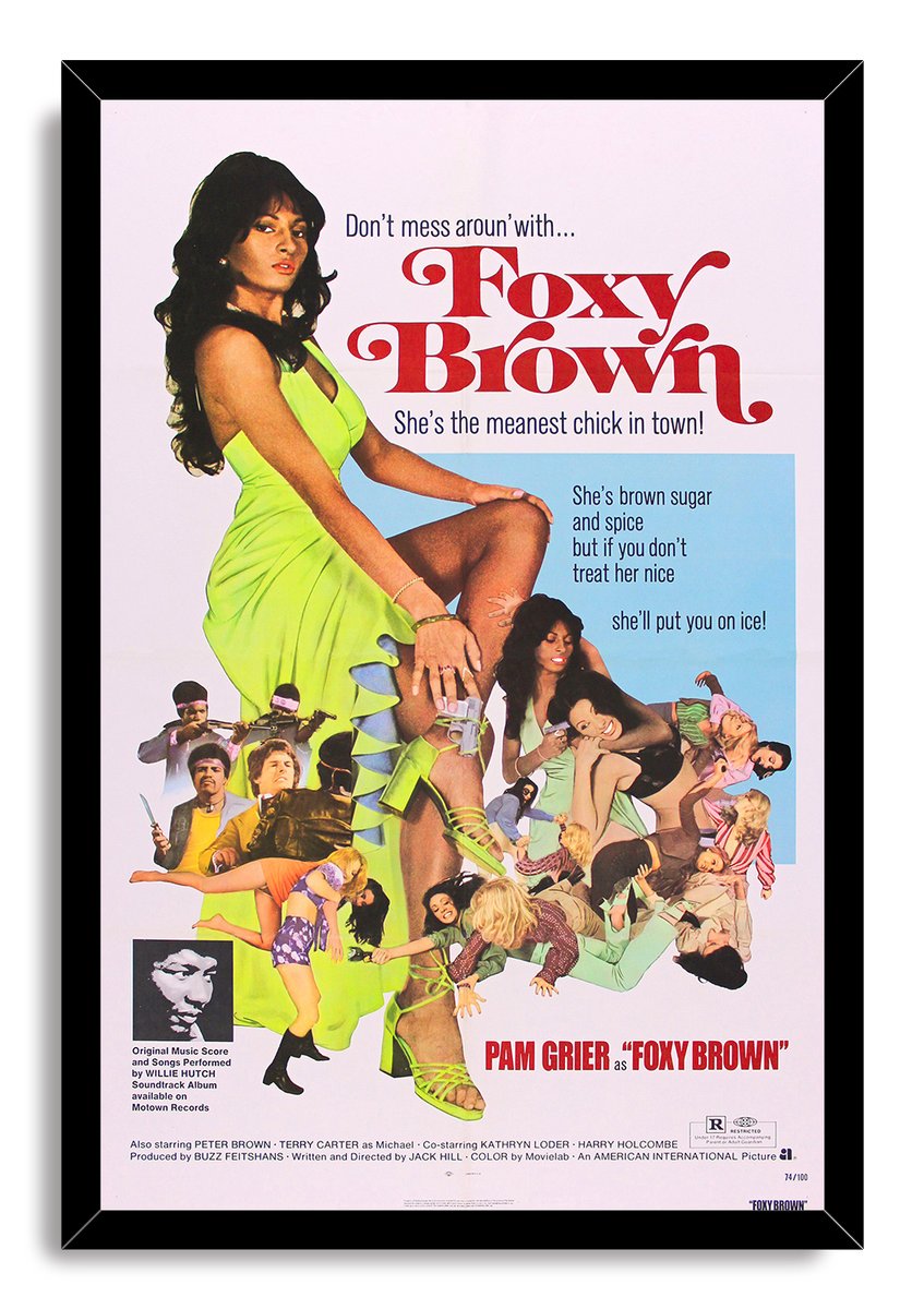 Foxy Brown framed wall art print featuring Pam Grier in a lime green dress, red typography, and a vibrant character collage.