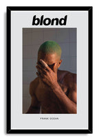 Frank Ocean Blond framed wall art print with black border, portraying a green-haired man covering his face against gray tiles.