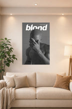 Frank Ocean Blond Album Cover in a bright living room above a beige sofa.