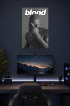 Frank Ocean Blond Album Cover in a gaming desk setup above a monitor.