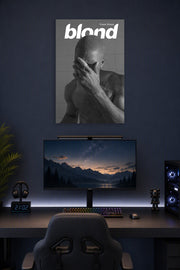 Frank Ocean Blond Album Cover in a gaming desk setup above a monitor.