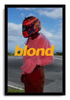 Frank Ocean Blonde album cover framed wall art print with a pink-hooded, helmeted figure standing beside a racetrack under blue skies.
