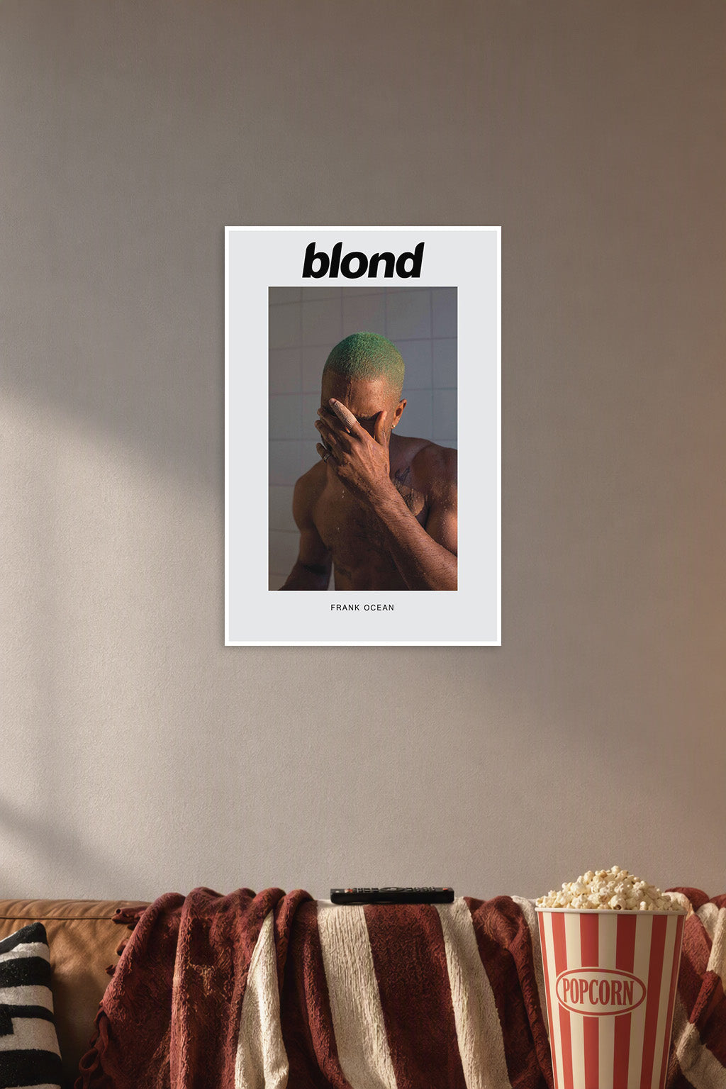 Frank Ocean Blonde Album Cover in a cozy movie room above a brown sofa with popcorn.