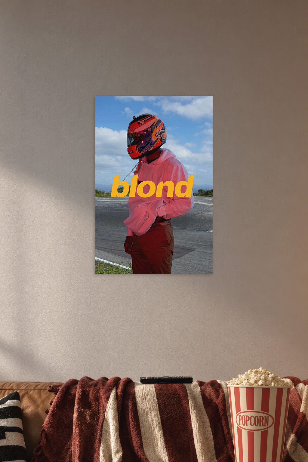 Frank Ocean Blonde Album Cover in a cozy movie room above a brown sofa with popcorn.