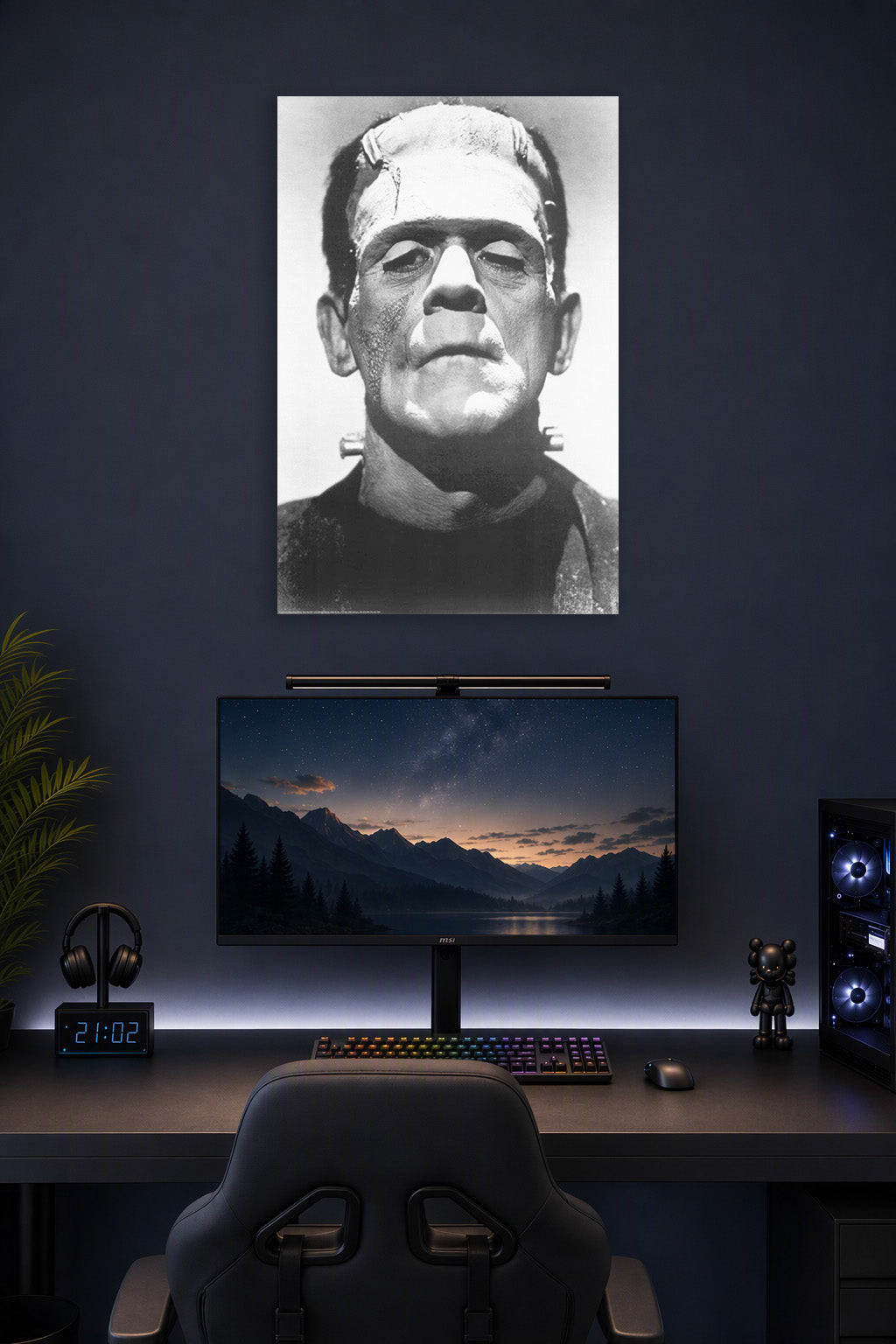 Frankenstein Boris Karloff B004008U2Q in a gaming desk setup above a monitor.
